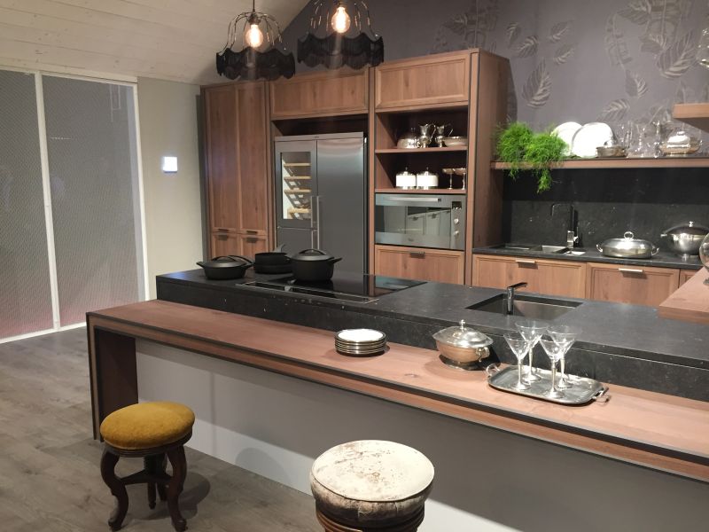 Brown and black marble kitchen design with multiheight level top