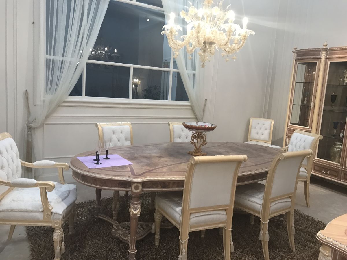 A lighter take on Baroque style distinguished this luxury dining room.