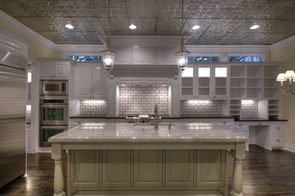A full tin ceiling can include recessed lighting as well as traditional fixtures.