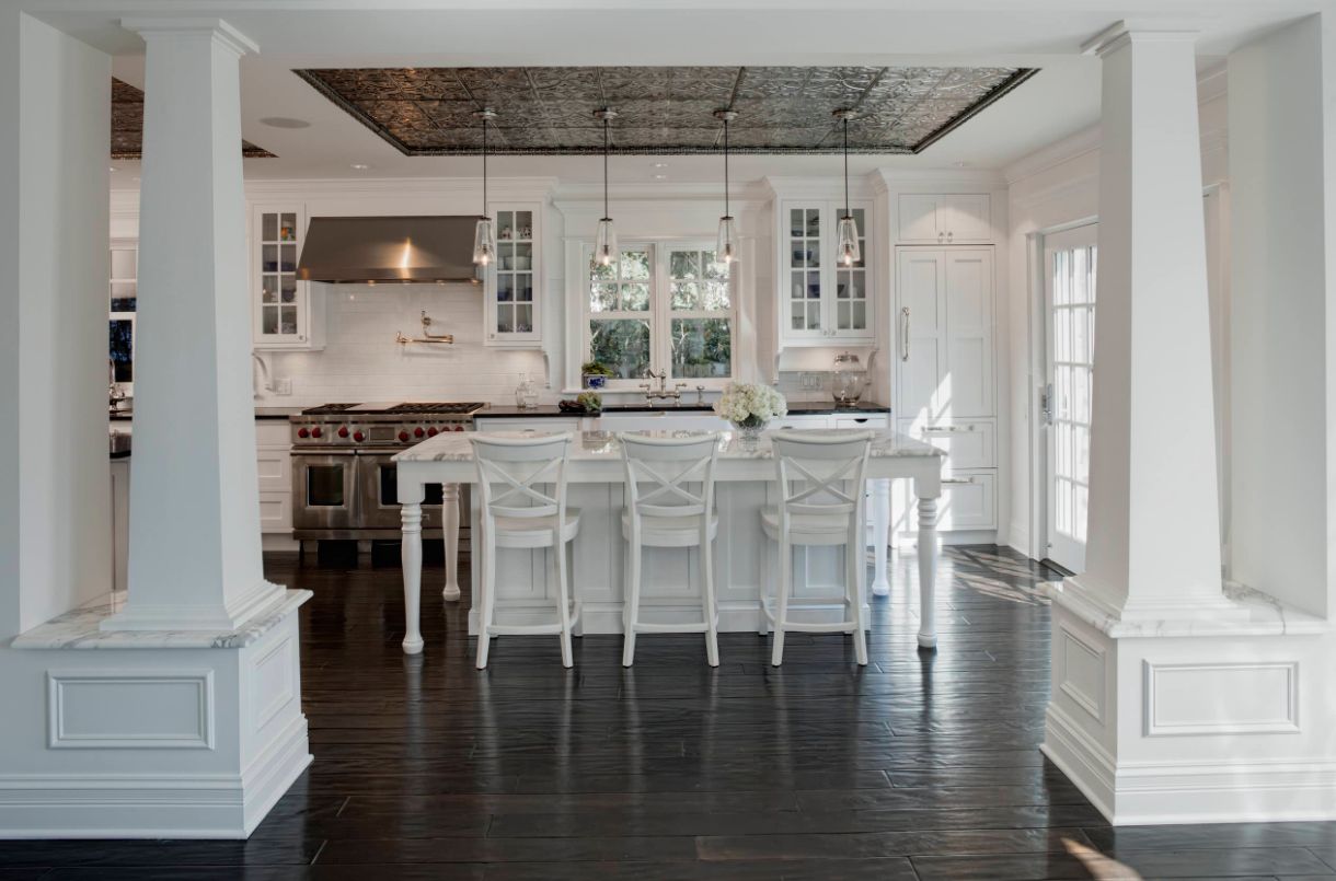 A tin ceiling can be used in a tray to accent a space like this kitchen island.