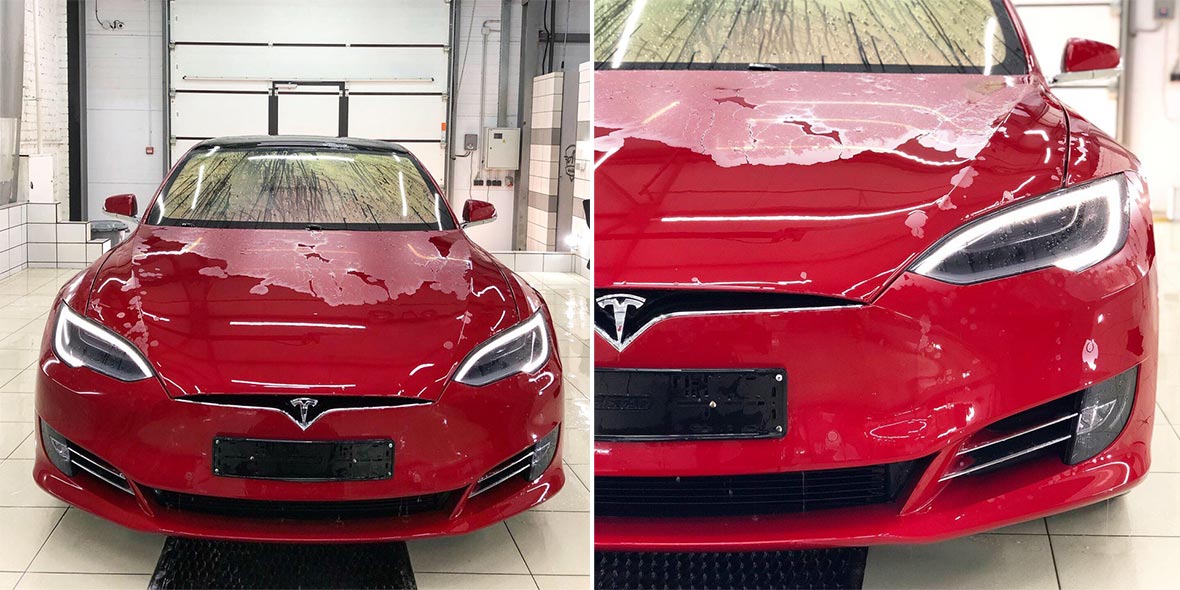 На фото автомобиль Тесла – процесс снятия виниловой ленки.